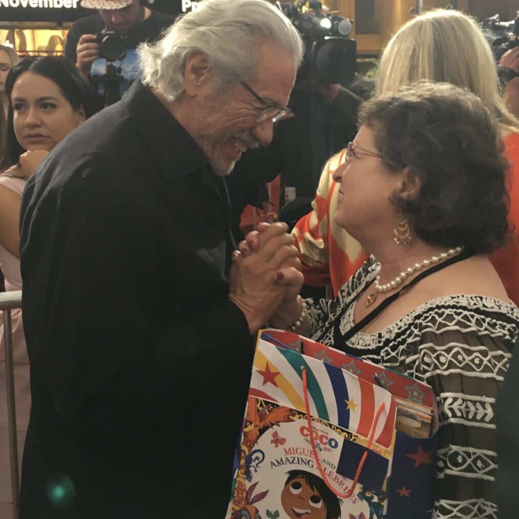 Photo Courtesy of Justin Daniel Ashford</br>
<span style="color:#EF4E24">Edward James Olmos and Roni <br>Background - Patty Rodríguez – <a href="https://lillibros.com/" target="_blank" rel="noopener noreferrer"><b>Lil’ Libros</b></span></a>